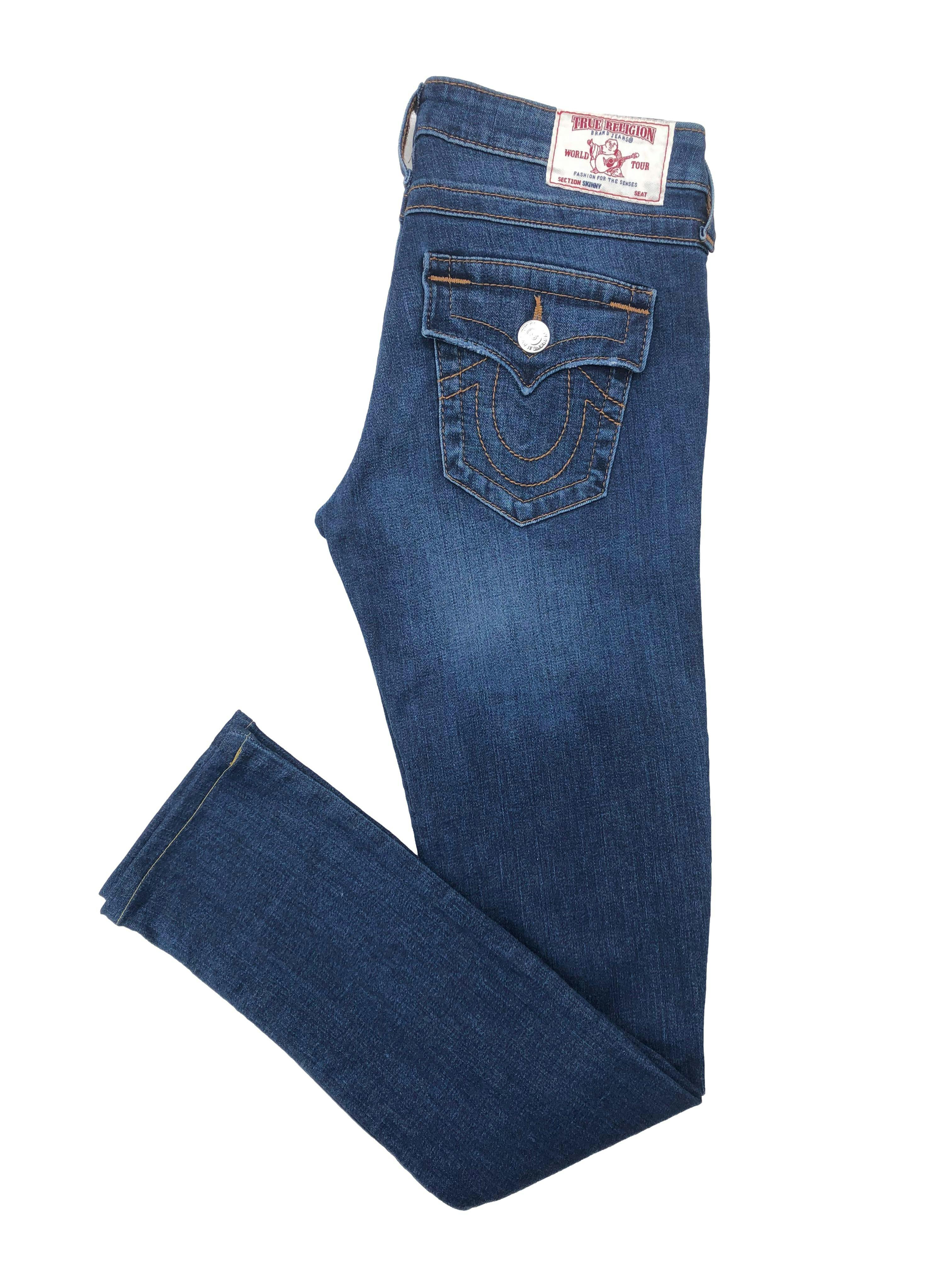 Skinny jean True Religion azul con rasgados y focalizado, Cintura 78cm Tiro 20cm Largo 100cm. Precio original S/ 600
