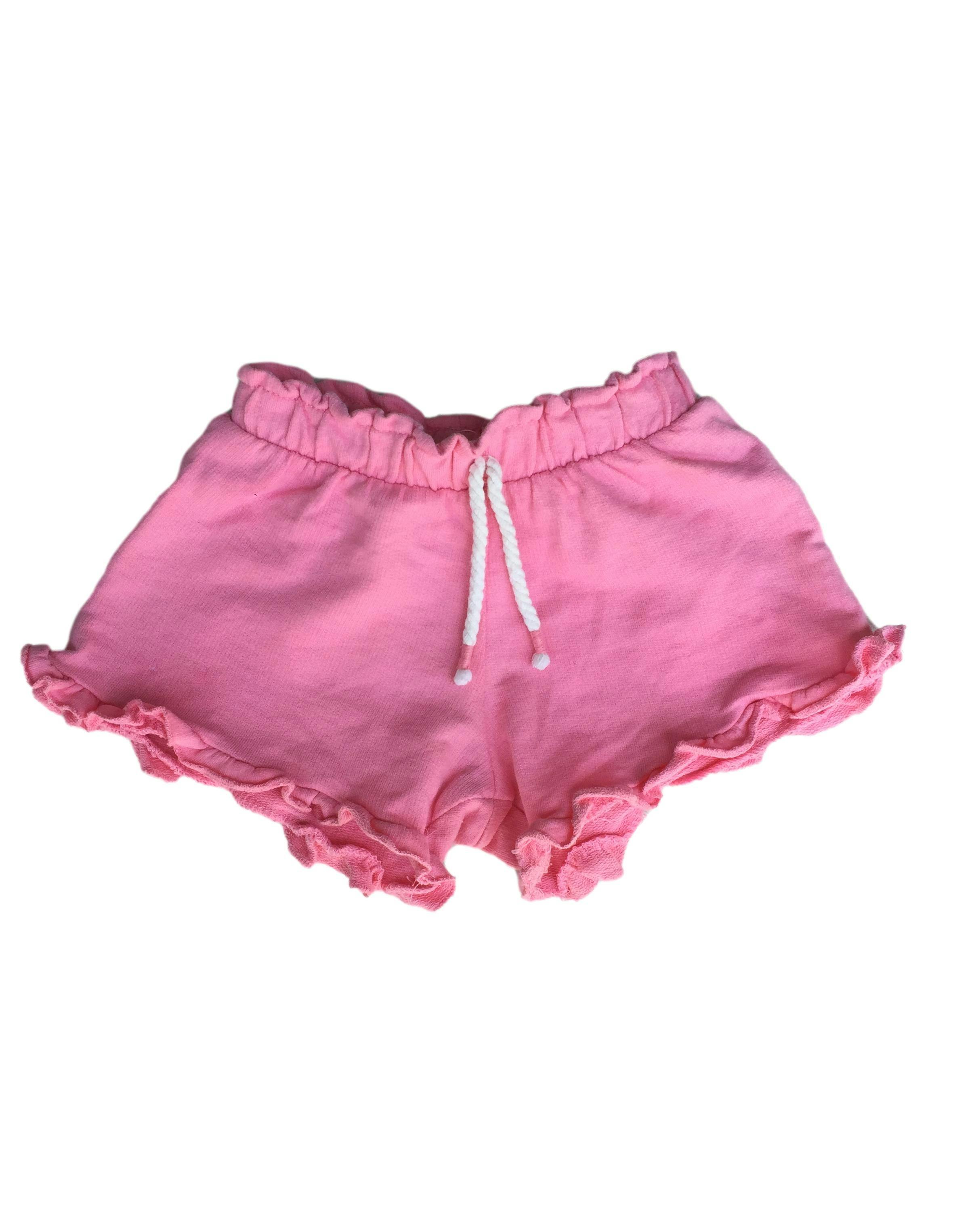 Short rosado con cintura elástica y volantes en basta.