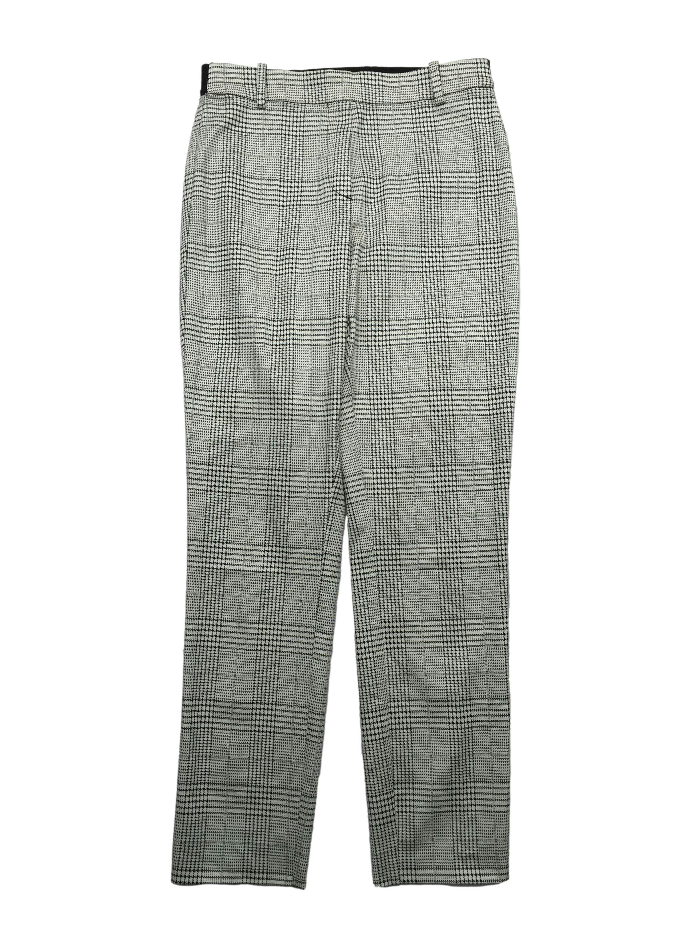 Pantalón slim fit H&M príncipe de gales blanco y negro, parte posterior con pretina elástica y falsos bolsillos. Cintura 70cm, Largo 93cm.