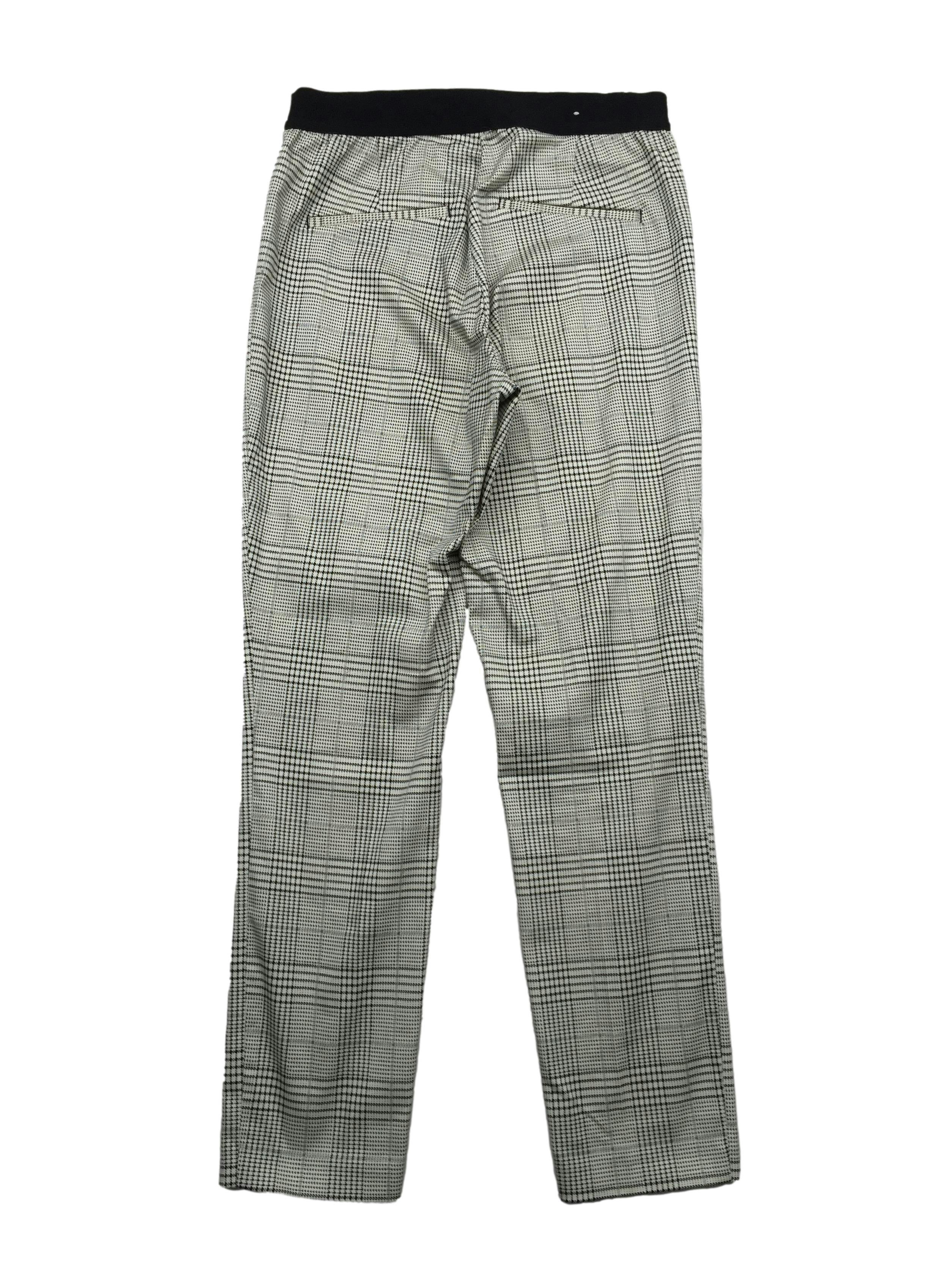 Pantalón slim fit H&M príncipe de gales blanco y negro, parte posterior con pretina elástica y falsos bolsillos. Cintura 70cm, Largo 93cm.